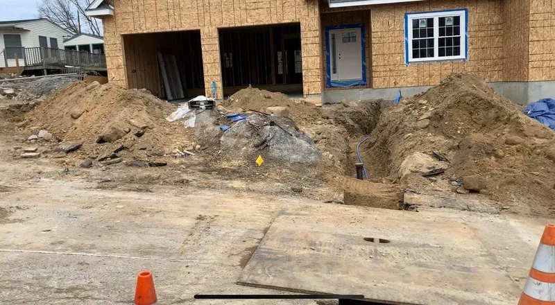 Trench and steel plate at a new construction site