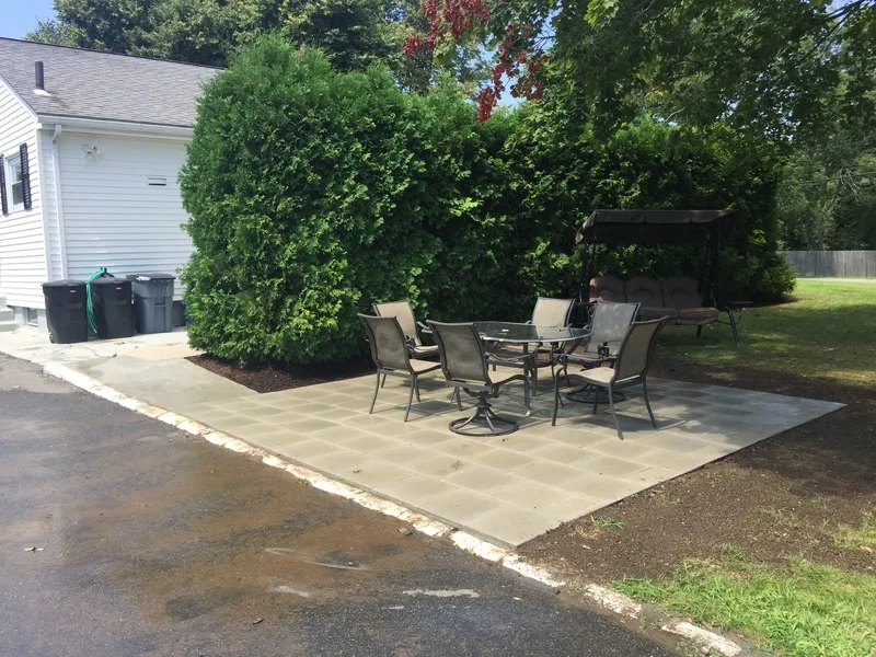 Paver patio with an outdoor dining set
